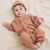 Baby is wearing the Garbo and Friends Sorrel Chestnut Romper.
