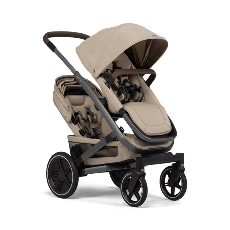 Joolz Geo 3 Zwillingskinderwagen mit einem Sitz oben und einen Sitz unten in Beige.