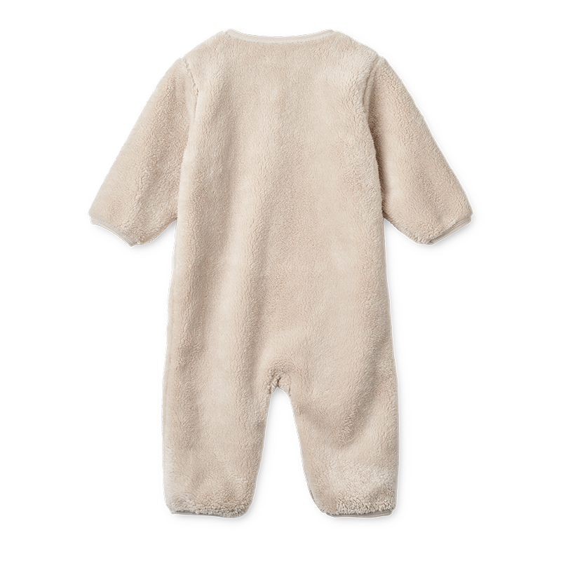 Baby-Overall in Beige von Liewood von hinten.