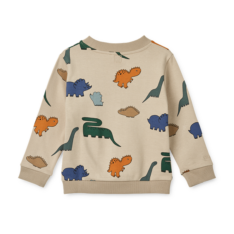 Pullover in Beige für Kinder mit buntem Dinosauriermuster von Liewood.