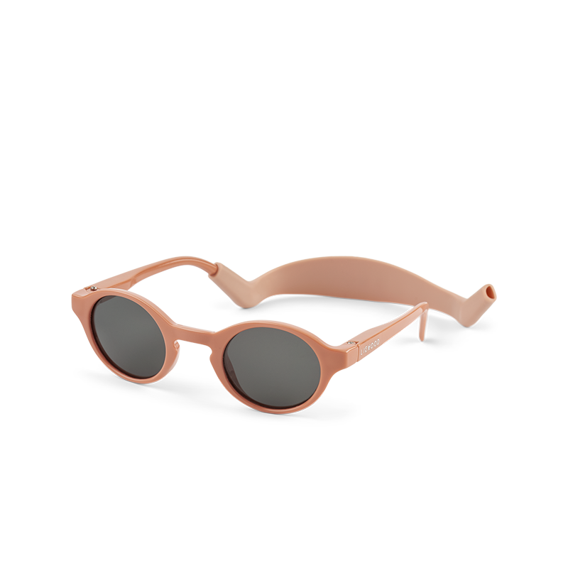 Babysonnenbrille mit rosa Rahmen und rosa Silikonband von Liewood. 