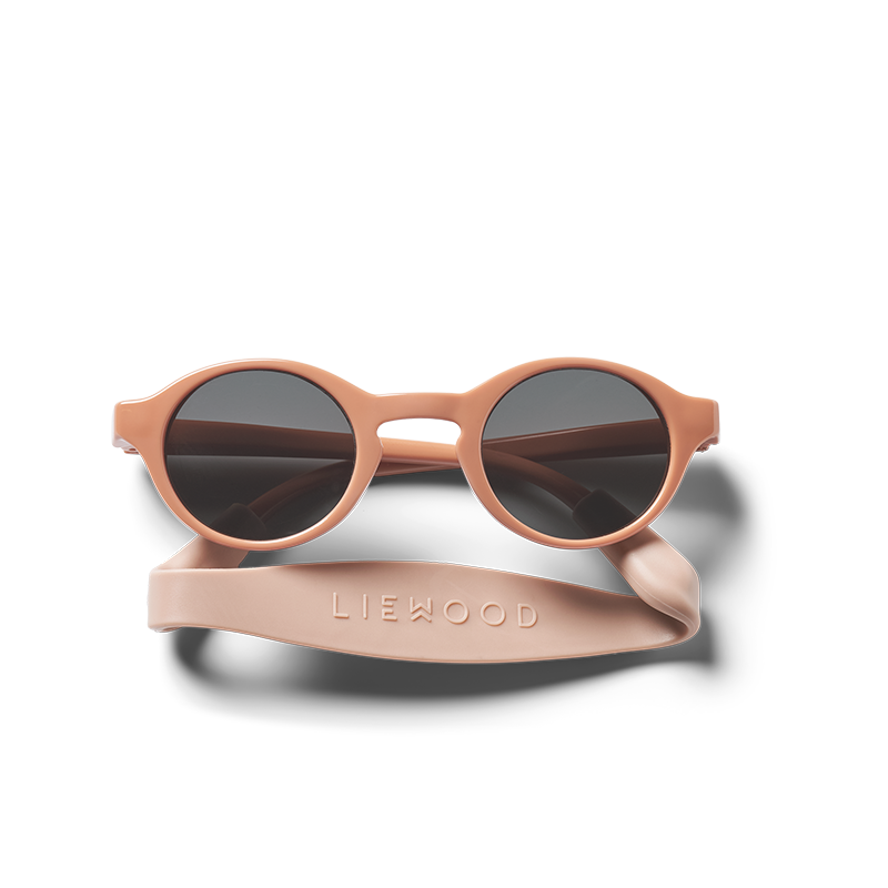 Babysonnenbrille mit rosa Rahmen und rosa Silikonband von Liewood. 
