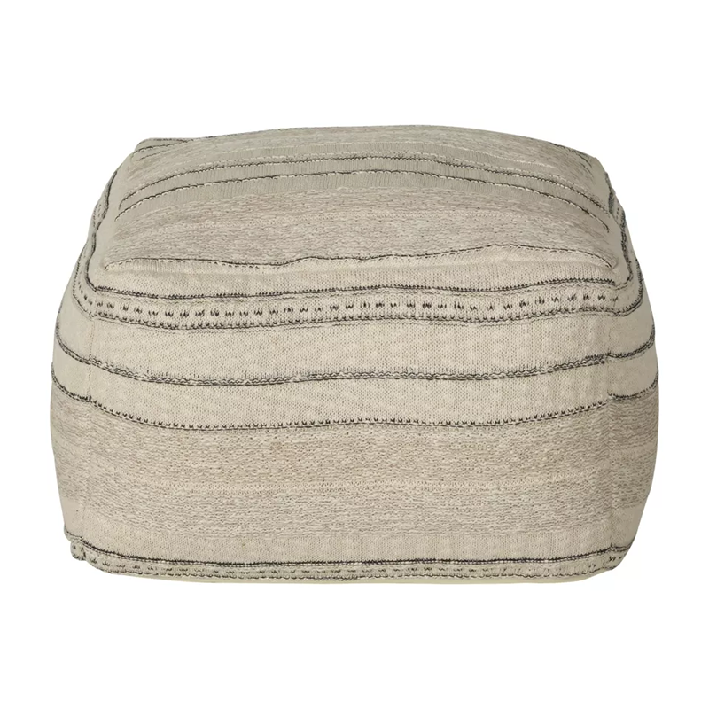 Pouf in Beige mit feinem schwarzen Strickmuster von Quax. 