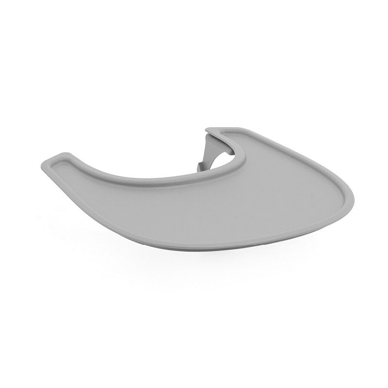 Stokke Tischchen für den Nomi Hochstuhl in Grau von der Seite. 